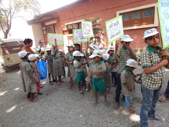 Children marching for prerserving trees & Water